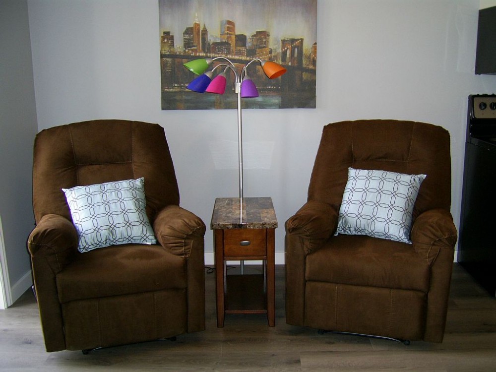 Sidney vacation rental with Relax in living room on recliner chairs